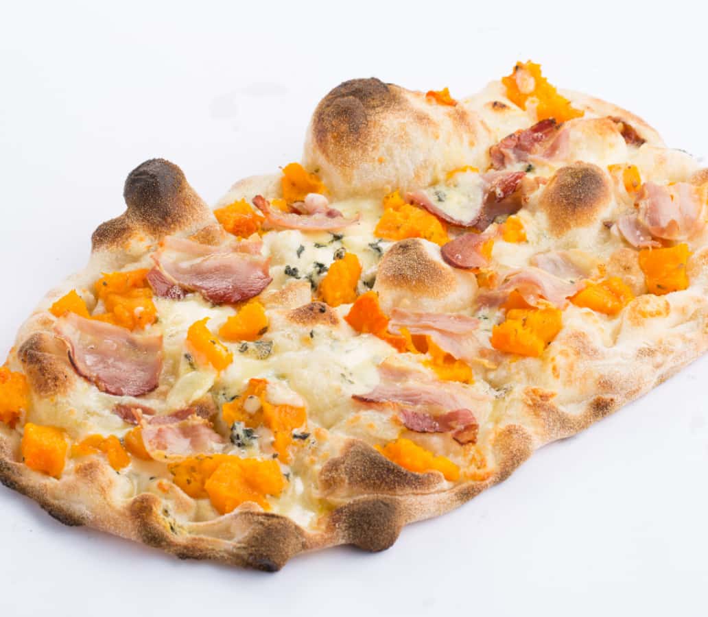 Photo of a Pinsa topped with pumpkin and bacon